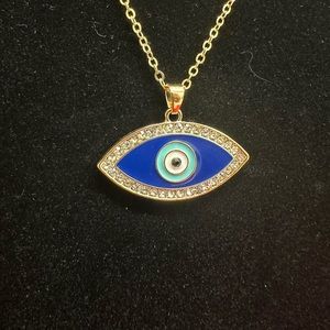 gold tone chain with turkish eye pendant